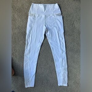 Jala clothing- white legging with mesh cut outs on hips and legs. Size small